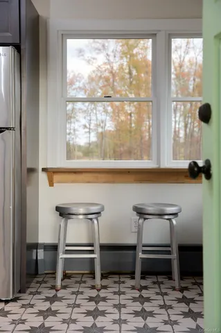 a living room with a table and a window