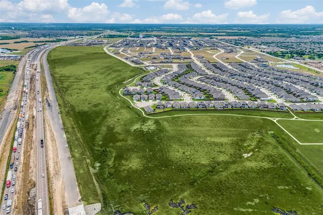a view of a swimming pool with a garden