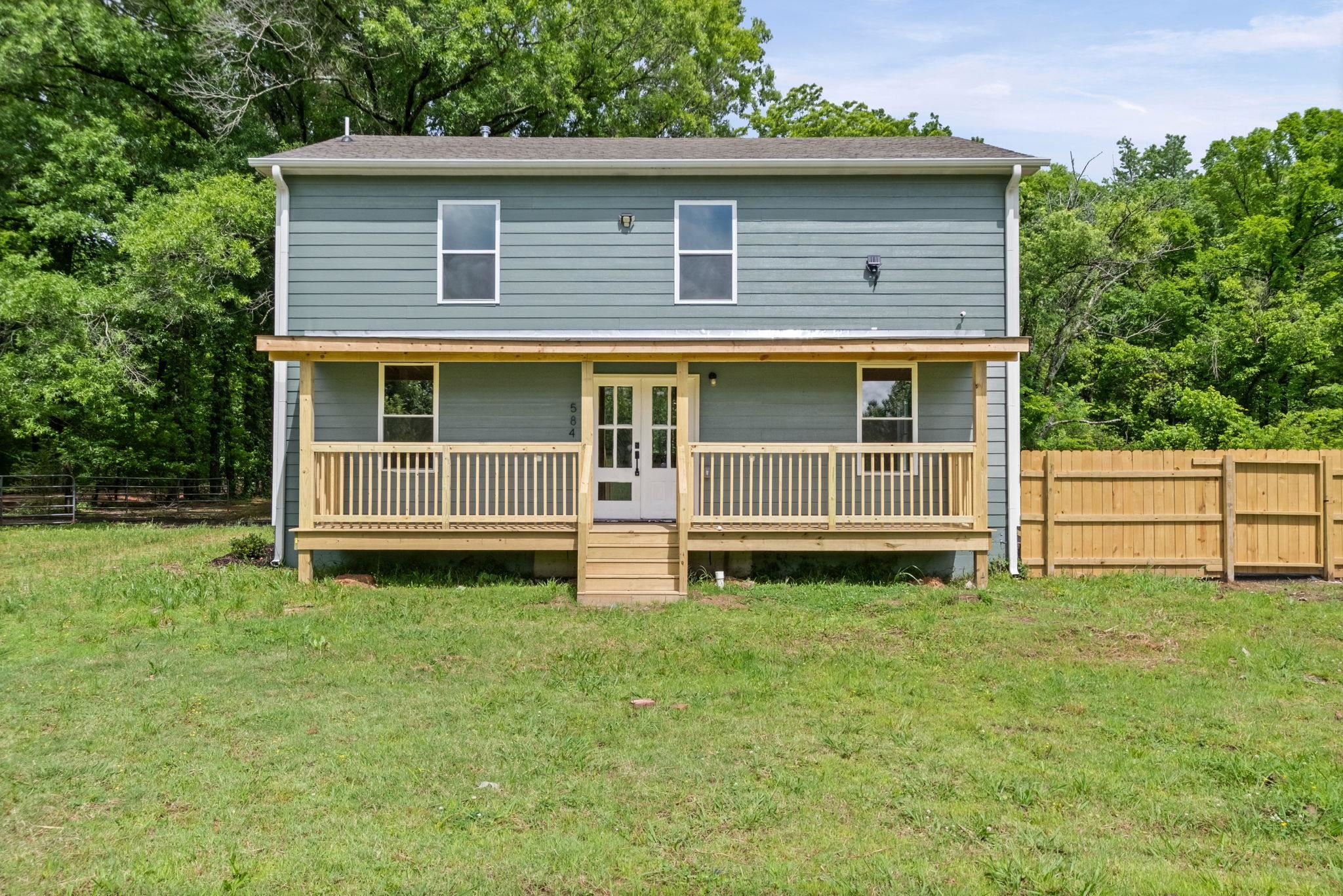 5843 Stewart Road Lakeland, TN 38002 - Photo 4 of 26 Two-story exterior with light blue horizontal siding