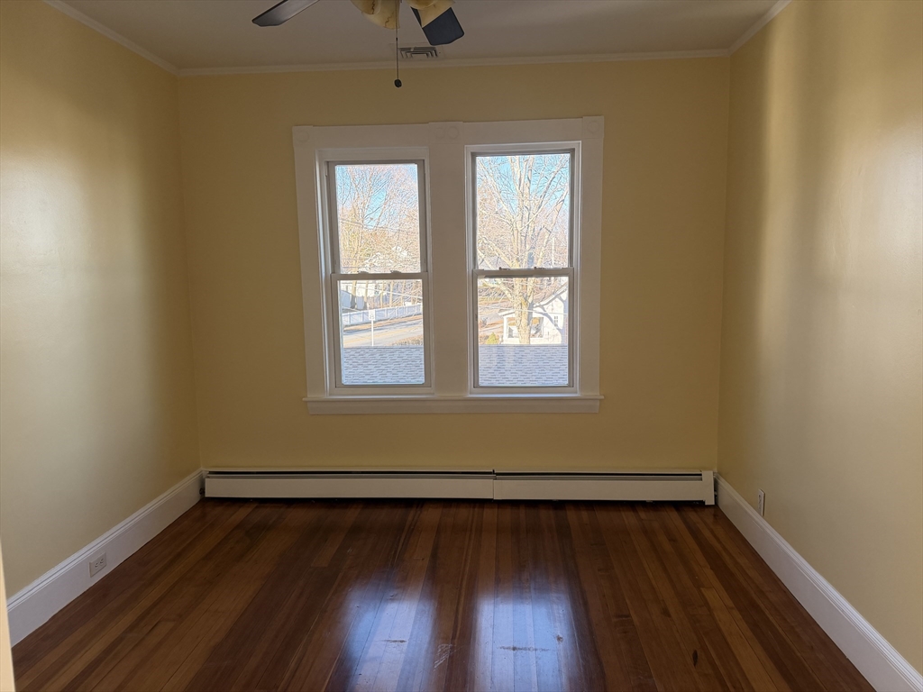 3-5 Milk Street, Unit 2 Methuen, MA 01844 - Photo 3 of 12 a view of a room with wooden floor and window