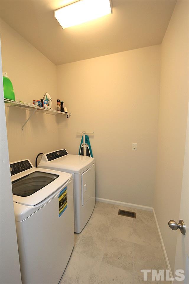 6108 Beale Loop Raleigh, NC 27616 - Photo 14 of 19 a utility room with dryer and washer