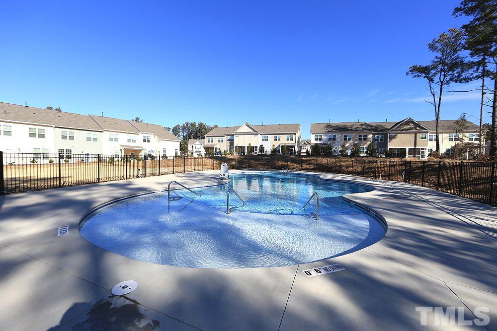 6108 Beale Loop Raleigh, NC 27616 - Photo 19 of 19 a view of a swimming pool with a terrace