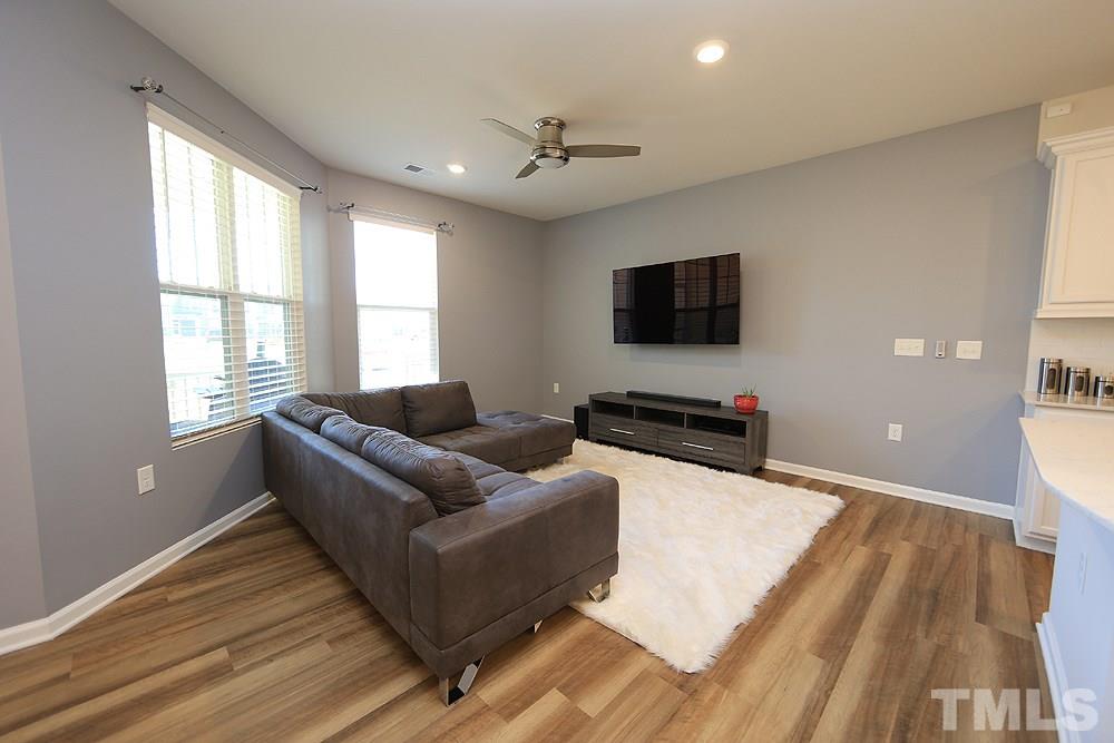 6108 Beale Loop Raleigh, NC 27616 - Photo 5 of 19 a living room with furniture and a flat screen tv