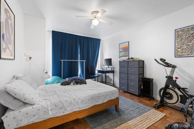 a bedroom with furniture and a window