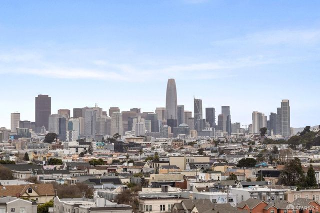 a view of a city with tall buildings in the background