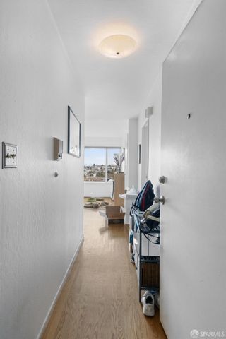 a view of a livingroom with furniture and a window