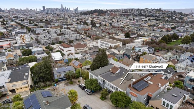 an aerial view of a city with lots of residential buildings