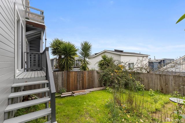 a view of a backyard with plants