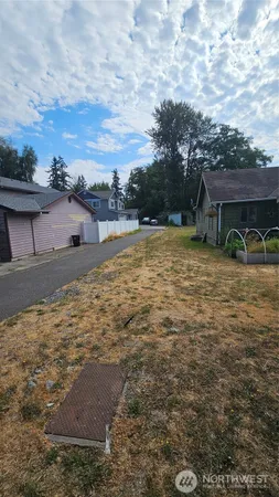 a backyard of a house with lots of green space