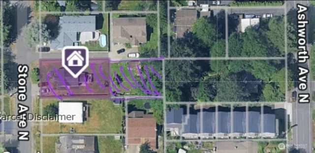 a street sign on a wall next to a building