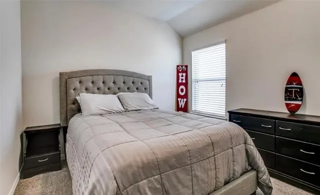 a bedroom with a bed and a closet