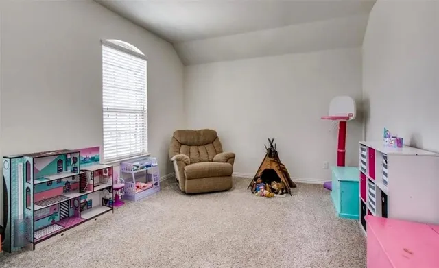 a room with toys and a wooden floor
