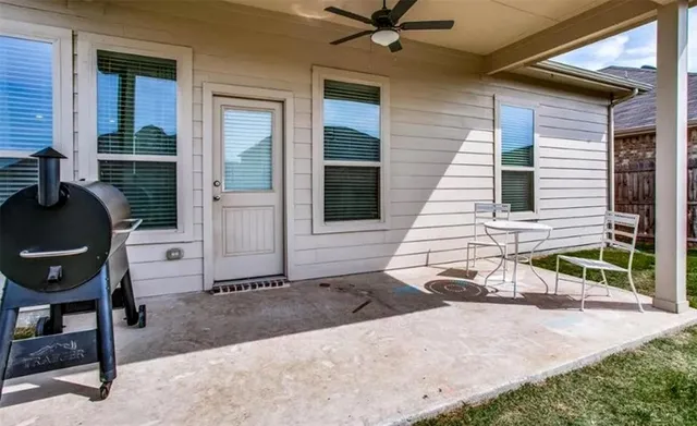 a front view of a house with outdoor seating