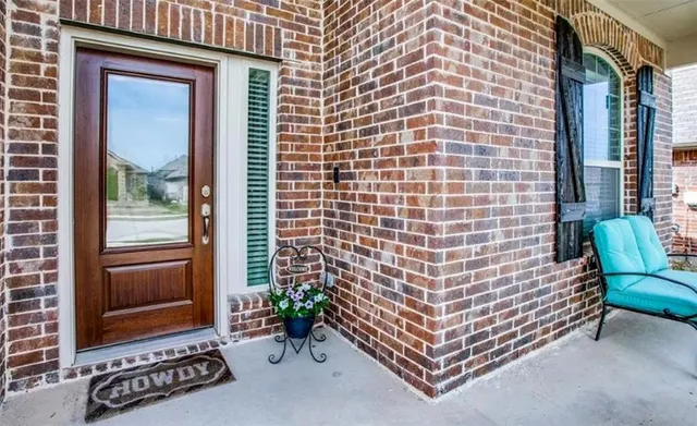 a front view of a house with a large window