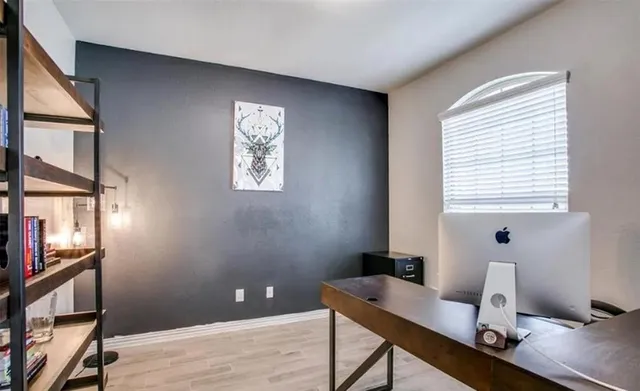 a workspace with furniture and window