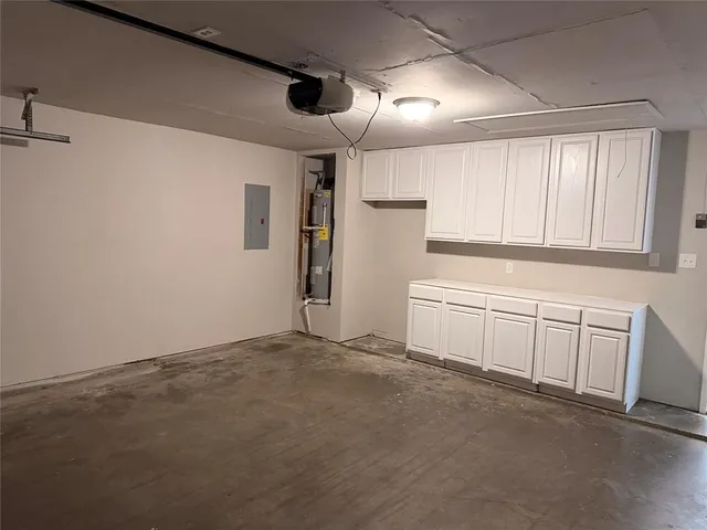 a view of backyard with wooden fence