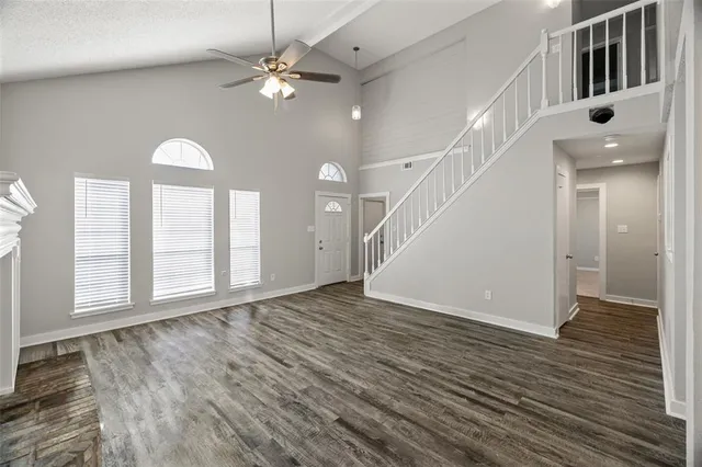 a view of an entryway with wooden floor