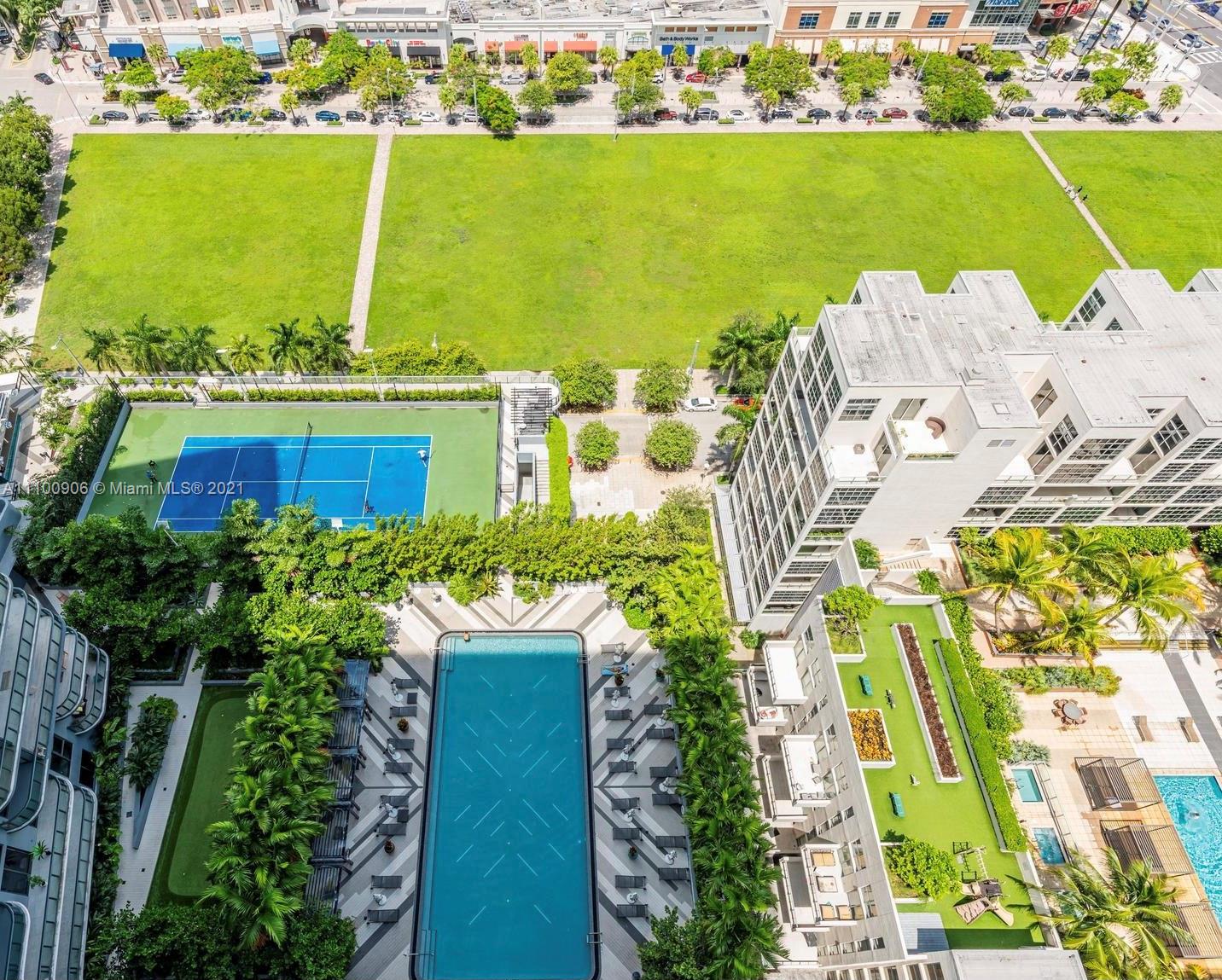 121 Northeast 34th Street, Unit L302 Miami, FL 33137 - Photo 1 of 10 an aerial view of residential houses with outdoor space and ocean view