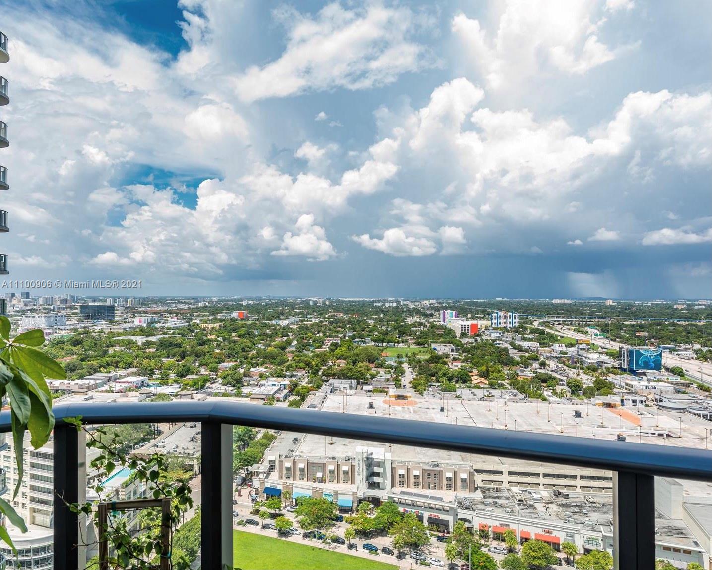 121 Northeast 34th Street, Unit L302 Miami, FL 33137 - Photo 5 of 10 a view of a city skyline from a balcony
