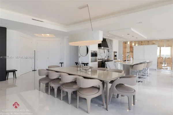 a kitchen with stainless steel appliances kitchen island granite countertop a sink and cabinets