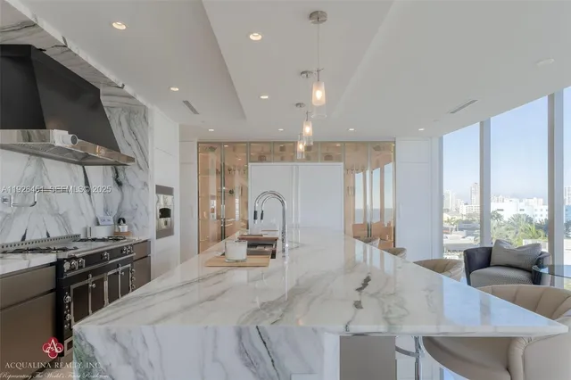 a large kitchen with a large counter top appliances and cabinets