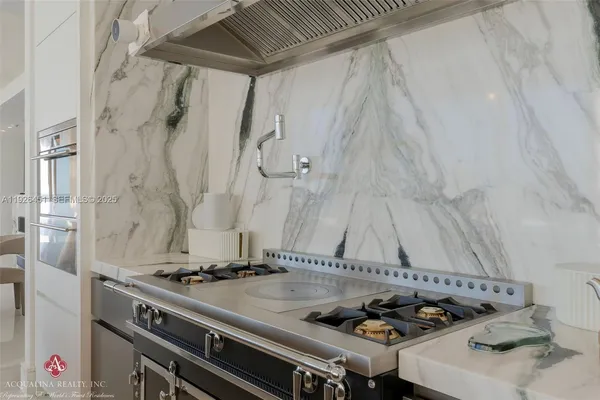 a bedroom with a bed and glass window