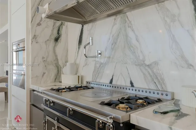 a bedroom with a bed and glass window