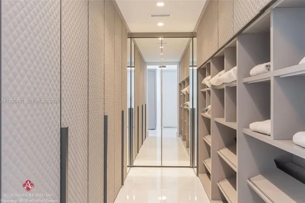 a bathroom with a sink a shower and a mirror