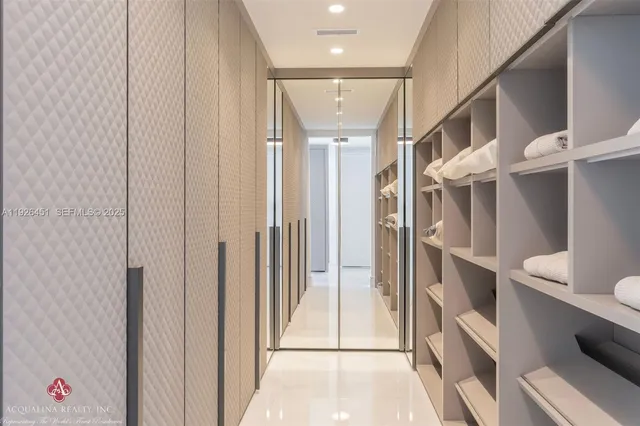 a bathroom with a sink a shower and a mirror