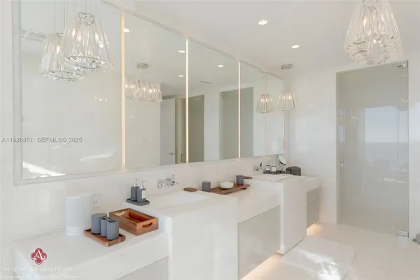 a bathroom with a shower sink mirror and toilet