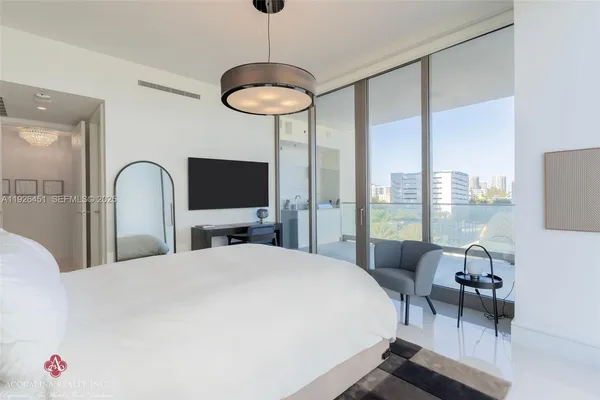 a bathroom with a granite countertop sink a mirror and shower