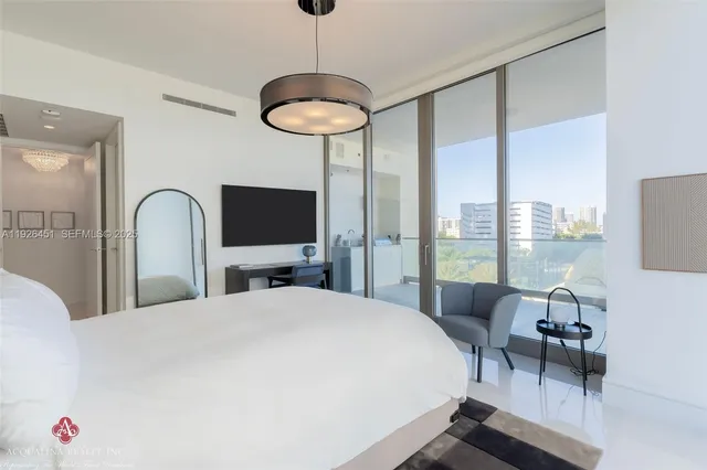 a bathroom with a granite countertop sink a mirror and shower