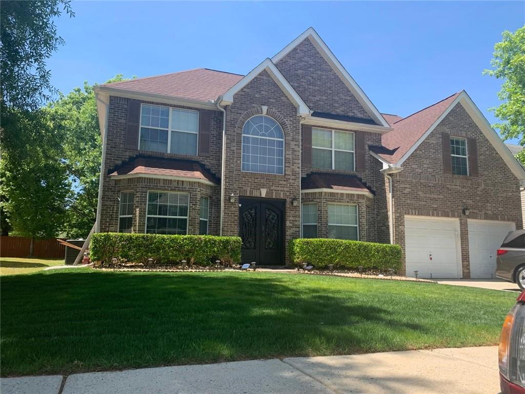 424 Browning Field Way Hampton, GA 30228 - Photo 1 of 1 a front view of a house with a garden