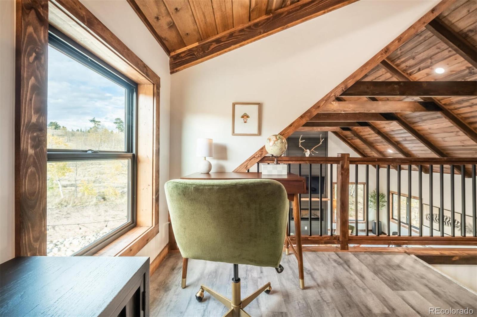 203 High Creek Road Fairplay, CO 80440 - Photo 18 of 30 a workspace with wooden floor and a window