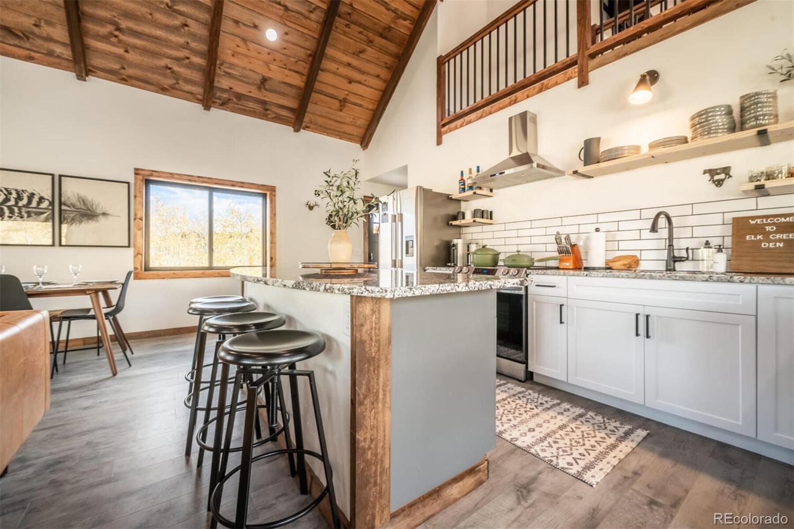 203 High Creek Road Fairplay, CO 80440 - Photo 8 of 30 a kitchen with furniture a refrigerator and dining table