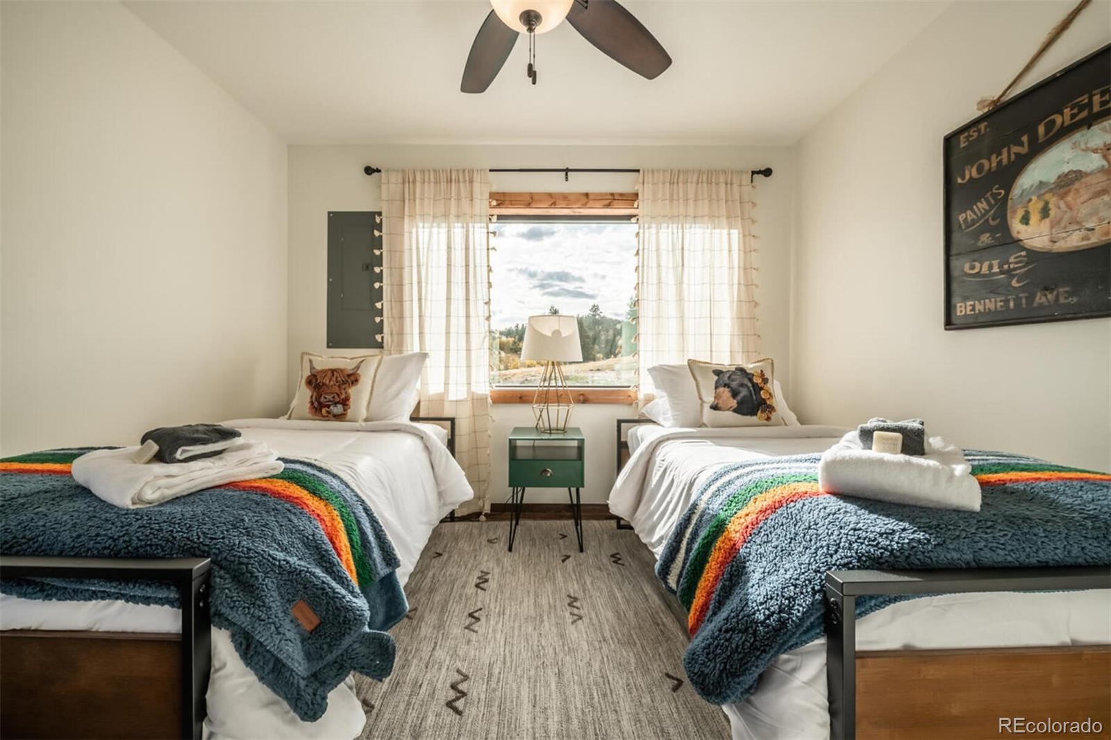 203 High Creek Road Fairplay, CO 80440 - Photo 9 of 30 a bedroom with two beds and a large window