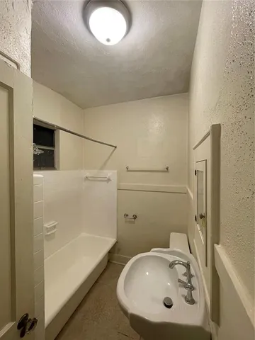 a bathroom with a sink and mirror