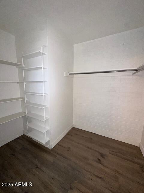 2551 West Berridge Lane, Unit D6 Phoenix, AZ 85017 - Photo 15 of 20 a view of a room with wooden floor and cabinet