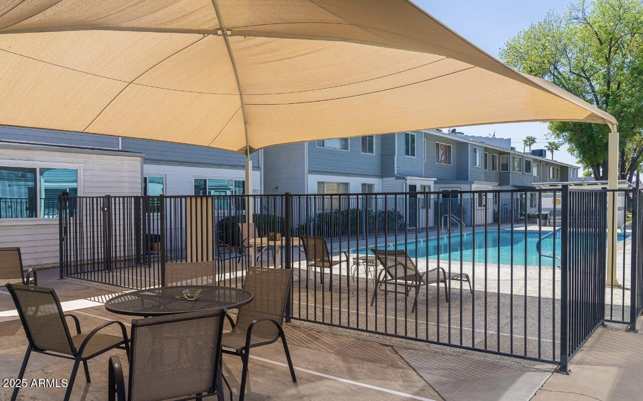 2551 West Berridge Lane, Unit D6 Phoenix, AZ 85017 - Photo 20 of 20 a view of backyard with roof deck and outdoor seating