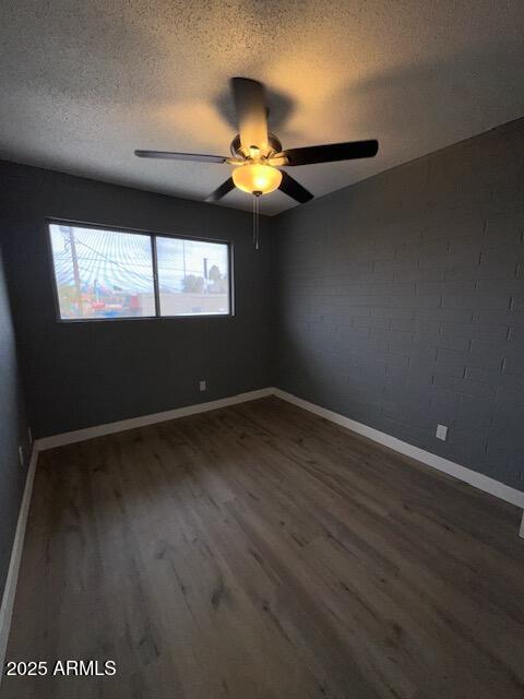 2551 West Berridge Lane, Unit D6 Phoenix, AZ 85017 - Photo 10 of 20 a view of a room with wooden floor and windows