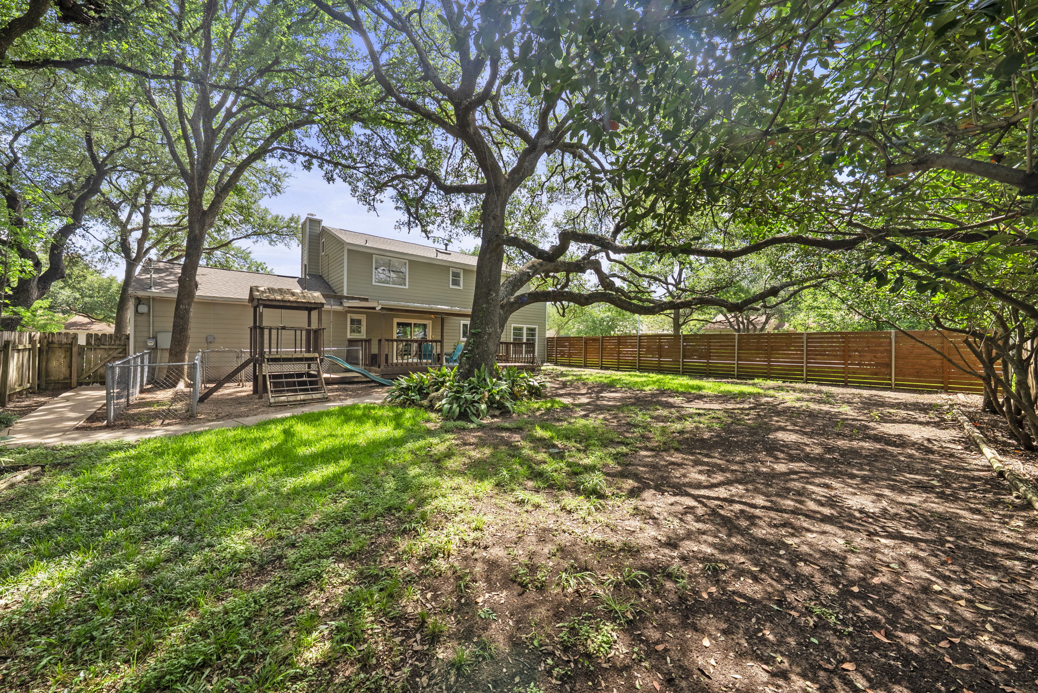 11405 Pyreneese Drive Austin, TX 78759 - Photo 30 of 37 a view of a yard with plants and trees