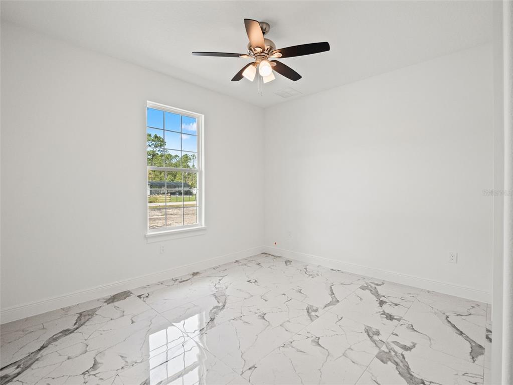 42430 Fir Street Eustis, FL 32736 - Photo 21 of 44 wooden floor in an empty room with a window