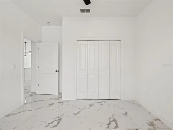 an empty room with white walls
