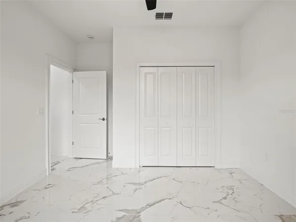 a view of an empty room and window