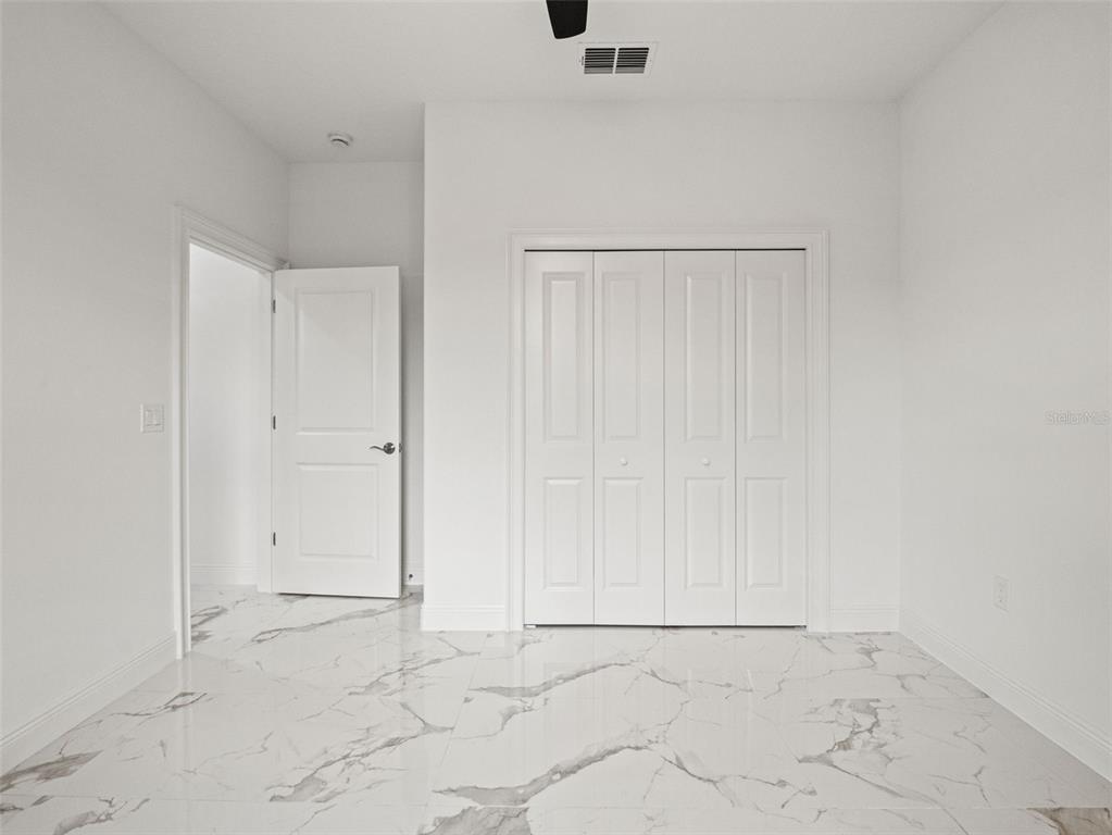 42430 Fir Street Eustis, FL 32736 - Photo 25 of 44 an empty room with white walls