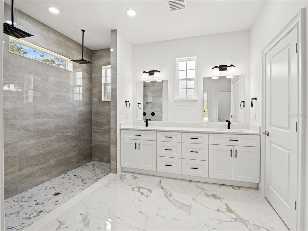 42430 Fir Street Eustis, FL 32736 - Photo 32 of 44 a bathroom with a sink shower and a mirror