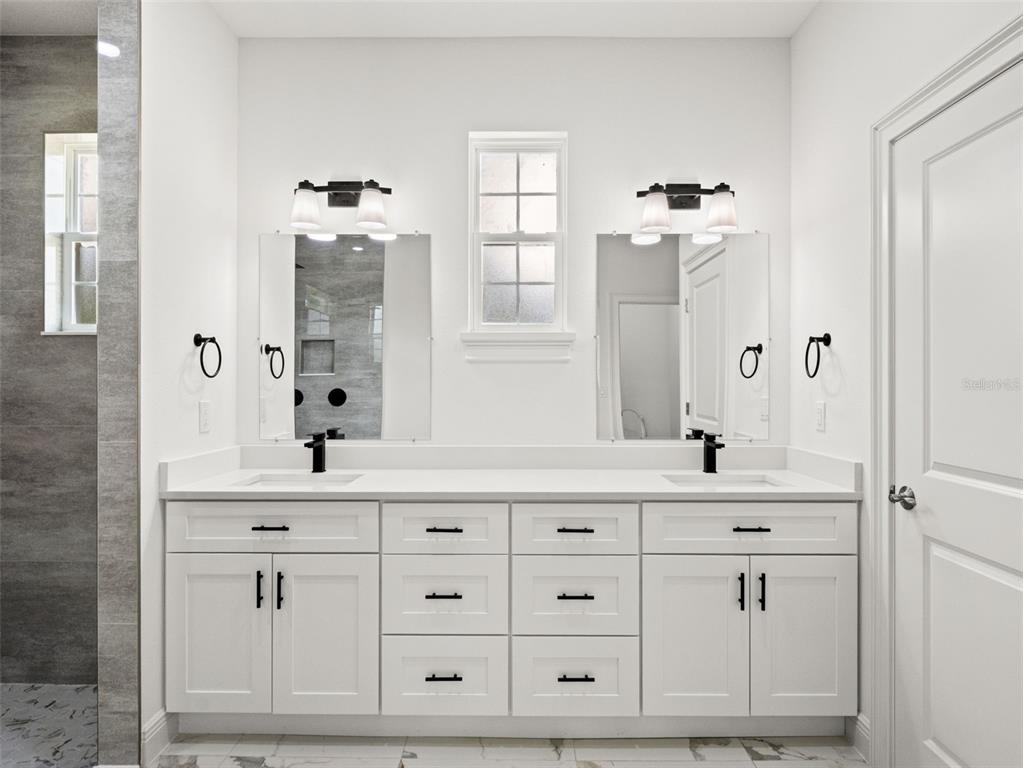 42430 Fir Street Eustis, FL 32736 - Photo 33 of 44 a bathroom with a sink vanity and mirror