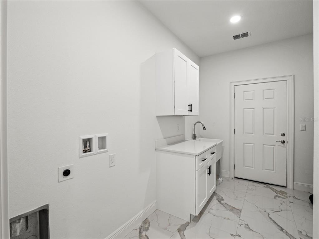 42430 Fir Street Eustis, FL 32736 - Photo 37 of 44 a view of a storage & utility room in a house
