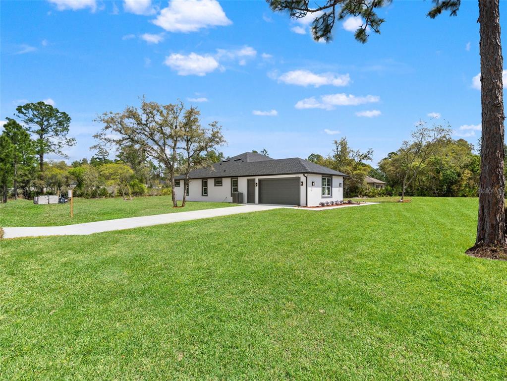 42430 Fir Street Eustis, FL 32736 - Photo 39 of 44 a front view of a house with a yard