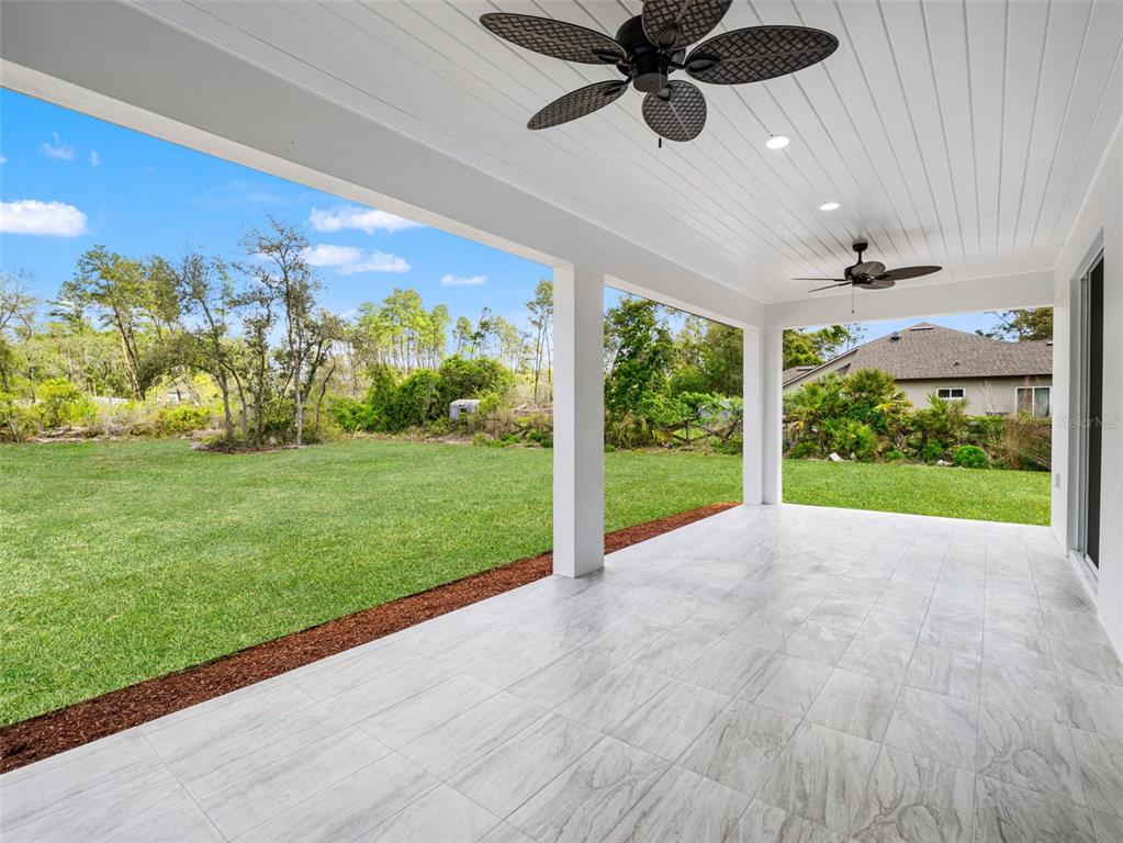 42430 Fir Street Eustis, FL 32736 - Photo 40 of 44 a view of an entryway with a garden